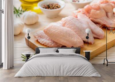 fresh raw chicken wings on wooden board Wall mural