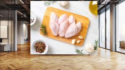 fresh raw middle chicken wings on wooden board Wall mural