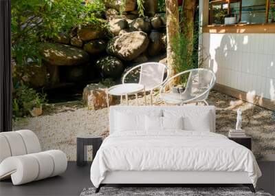 white chair in the garden Wall mural