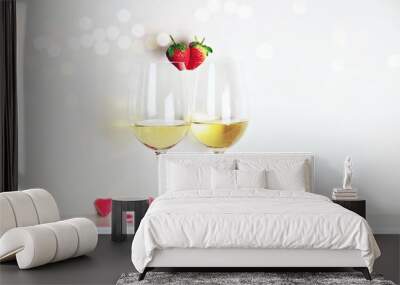 Two glasses of white wine with strawberry heart shape. Valentine's day  Wall mural