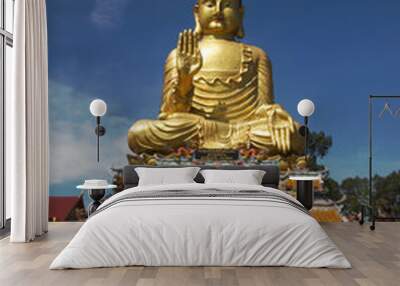 Pra Put Ratanamani Srihathai Naresuan or Luang Por Pan Lan large golden sitting outdoor Buddha in Wat Maniwong. It is a beautiful and faithful Buddha image. Located at Nakhon Nayok Province in Thailan Wall mural