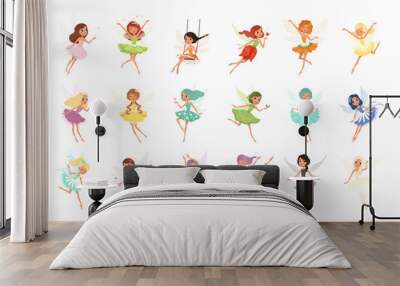 Colorful set of fairies in flying action. Little creatures with colorful hair and wings. Mythical fairy tale characters in cute dresses. Flat vector design Wall mural