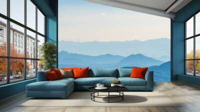 Landscape of mountains range with morning frog for mountain background. Wall mural