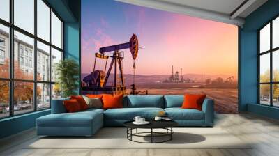 Oil pump energy industrial machine for petroleum oil industry equipment in the sunset. Wall mural