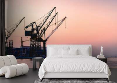 silhouette of container port at kobe japan, container crane at industrial port for cargo container s Wall mural