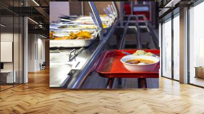 food bought in the dining room on a tray, the front and back background is blurred with a bokeh effect Wall mural