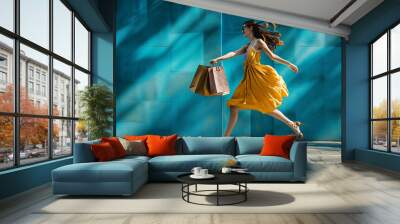 girl running with shopping bags on the blue background  09d67205-f9ba-4a10-aa03-eade5858f706 Wall mural