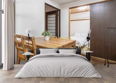 Brown wood dining table in the living room of an old Japanese-style house Wall mural