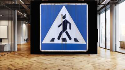 Old road sign 'Pedestrian crossing' isolated on black. Wall mural