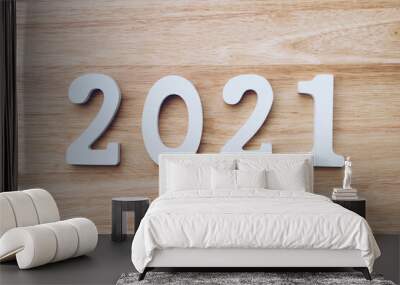 Business and design concept - wooden number 2021 for Happy new year text on wood table. Wall mural