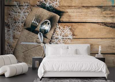 christmas table place setting and silverware, snowflakes on wooden background with space. Wall mural