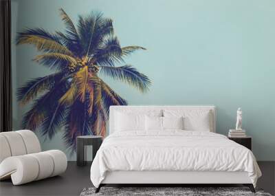 Coconut palm tree and blue sky vintage with space. Wall mural