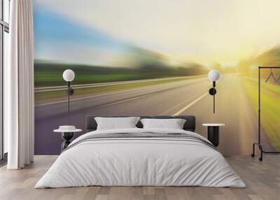 Empty asphalt road in motion blur and sunlight with vintage tone Wall mural