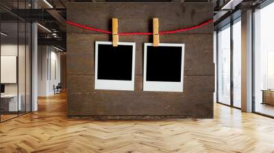 two blank photo frame hanging on wood background with space Wall mural