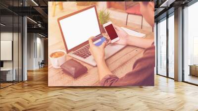 Young business man pay credit card in coffee shop with vintage f Wall mural