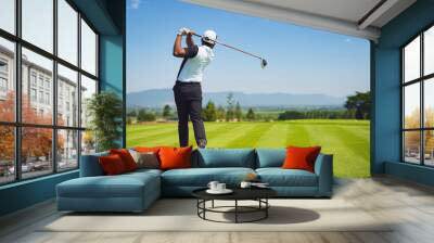 Asian man golfing on the course. In summer Wall mural