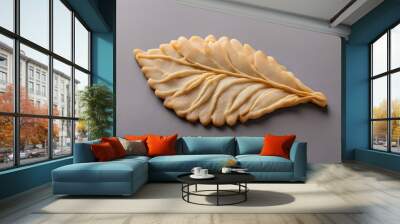 A thin and crispy tuille cookie shaped like a curved leaf, Ai Generated Wall mural