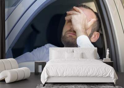 stressed and angry driver in his car Wall mural