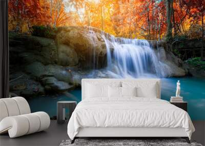 Amazing in nature, beautiful waterfall at colorful autumn forest in fall season Wall mural