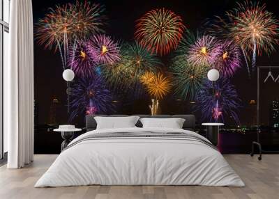 Beautiful colorful fireworks display on celebration night  Wall mural