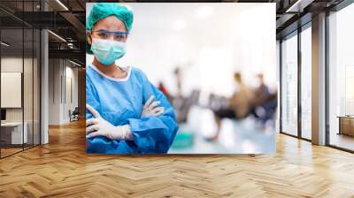 Doctors or surgeons wearing surgical mask with blur patient crowd background in hospital , during coronavirus or covid-19 crisis, medical concept. Wall mural