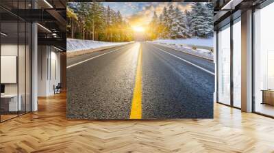 empty asphalt highway and winter forest nature landscape at sunrise Wall mural