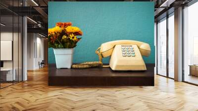 Old telephone with dust and scratches with vintage green background, retro style concept Wall mural