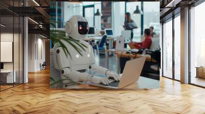 Humanoid robot working on a laptop in a modern office environment, surrounded by professionals, integration of ai and robotics in the workplace Wall mural