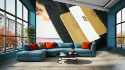 close up of credit cards in a wallet on wooden background  Wall mural