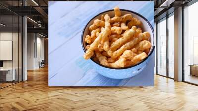 Close up of tasty chips in a bowl on table. Wall mural