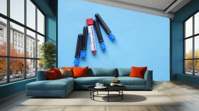 omicron variant corona virus blood test tube on blue background  Wall mural