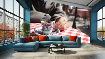 woman drinking turkish coffee at cafe  Wall mural