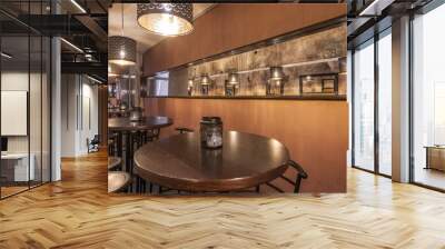 A group of circular high top tables with matching stools in a nightclub Wall mural