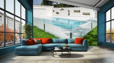 A white marble swimming pool with a glass railing, a lawned garden and flower pot niches in one wall Wall mural