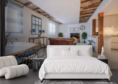 living room of a studio apartment with open kitchen, exposed vintage wooden beams, brown leather che Wall mural