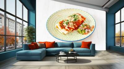 Mexican beef chimichanga wrapped in a wheat tortilla with tomato and cheese, guacamole and pico de gallo Wall mural