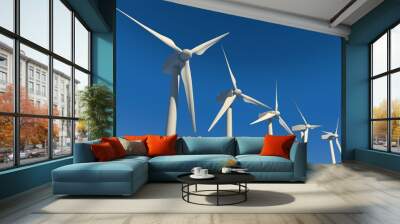 Five wind turbines on blue sky Wall mural