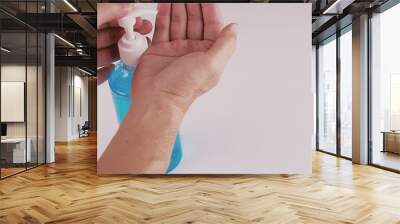 Plastic bottle pump with alcohol hand gel. Hand Sanitizer Antibacterial Cleansing Gel Alcohol Rub that could help protect against coronavirus. Wall mural