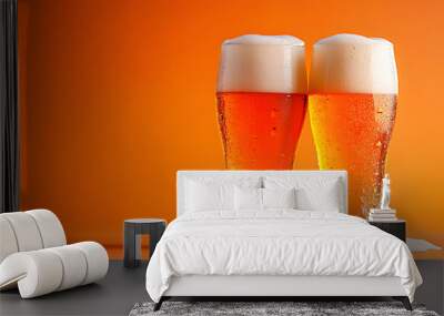 Two glasses of beer with foam on top of them Wall mural