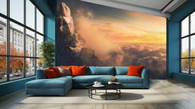 Beautiful aerial landscape of mountain peak at sunset above the clouds - panoramic Wall mural