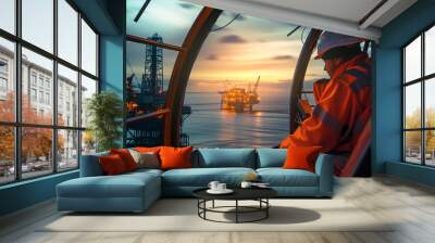 Inside helicopter photo of oil offshore drill platform worker dressed orange uniform flying to station.  Petroleum and gas extract and process exploration industry concept wide-angle image. Wall mural