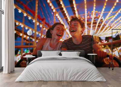 Portraits of two teenagers couple in love or brother and sister emotional screaming and laughing moment while they enjoying Roller coaster Funny time attraction ride on city carnival entertainment. Wall mural