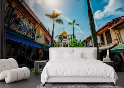 Young woman traveler traveling into The Masjid Sultan mosque located in Kampong Glam in Singapore city. Wall mural