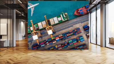 Aerial view and top view cargo plane flying above ship port in the export and import business and logistics international goods. Shipping cargo to harbor by crane Wall mural