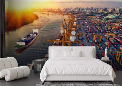 Container ship in import export and business logistic. Trade Port. Shipping, cargo to harbor and Cargo plane with working crane bridge in shipyard at sunrise, logistic import export and transport indu Wall mural