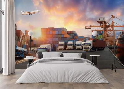 Container truck in ship port for business Logistics and transportation of Container Cargo ship and Cargo plane with working crane bridge in shipyard, logistic import export and transport concept Wall mural