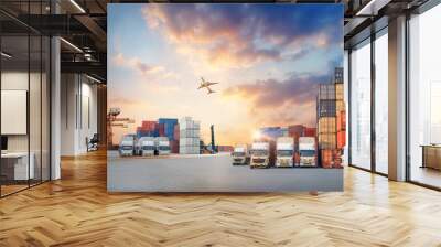 Container truck in ship port for business Logistics and transportation of Container Cargo ship and Cargo plane with working crane bridge in shipyard, logistic import export concept Wall mural