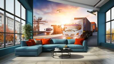 Container truck in ship port for business Logistics and transportation of Container Cargo ship and Cargo plane with working crane bridge in shipyard, logistic import export concept Wall mural