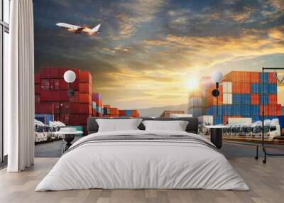 Container truck in ship port for business Logistics and transportation of Container Cargo ship and Cargo plane with working crane bridge in shipyard at sunrise, logistic import export and transport  Wall mural