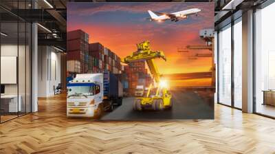 Container truck in ship port for business Logistics and transportation of Container Cargo ship and Cargo plane with working crane bridge in shipyard at sunrise, logistic import export and transport  Wall mural